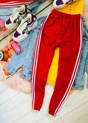 Нові спорт-штани.три смужки .