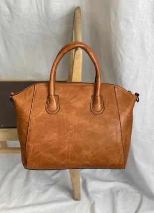 Ділова жіноча сумка портфель з двома ручками з еко шкіри на металевих ніжках.