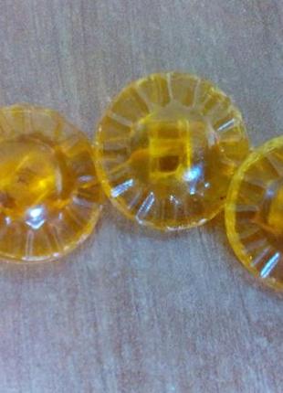 Пуговицы прозрачные желтые на ножке диаметр 14мм1 фото