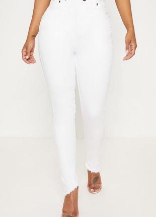 Ідеальні білі еластичні джинси скінні на дуже високій посадці з необробленим низом2 фото