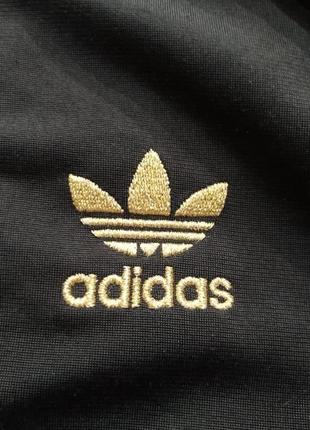 Adidas женский свитшот черно золотого цвета размер 402 фото