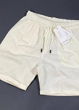 Чоловічі шорти lacoste у білому кольорі, стильні та зручні шорти на кожен день