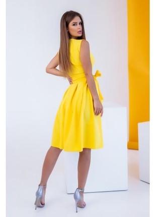 Желтое платье на запах с пышной юбкой3 фото