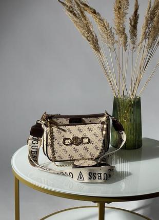 Сумочка від guess pochette multi cream