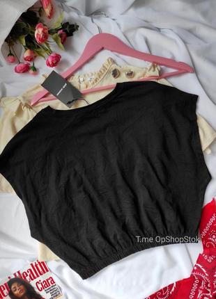 Черная женская укороченная футболка хлопковая с надписью низ резинка оверсайз3 фото
