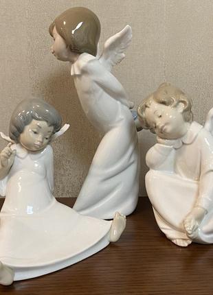 Фарфоровая статуэтка lladro «любопытный ангел».9 фото