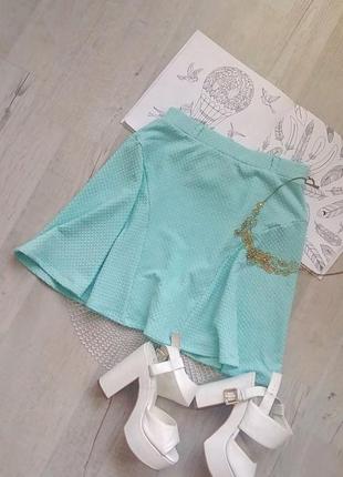 Бирюзовая мини юбка фирменная с текстурной ткани  солнце клеш интересный крой2 фото