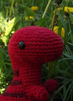 Игрушка красного динозавра