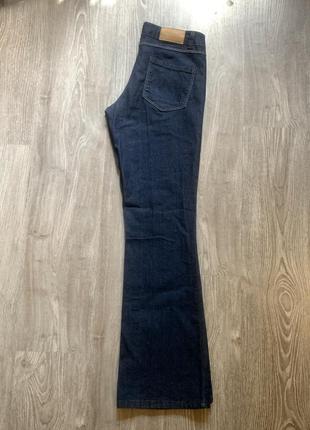 Нові сині джинси кльош від коліна1 фото