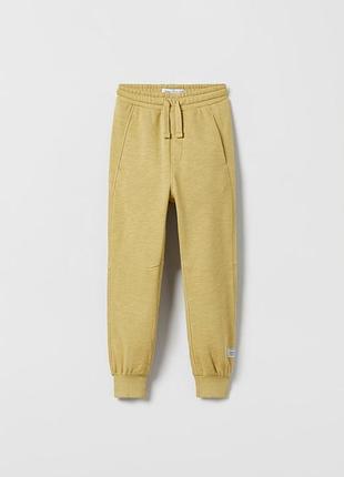 Меланжеві штани з оверлочними швами zara