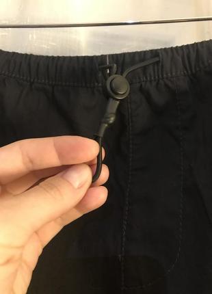 Черная юбка карго с карманами5 фото