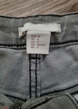 Короткие джинсовые шорты серого цвета4 фото