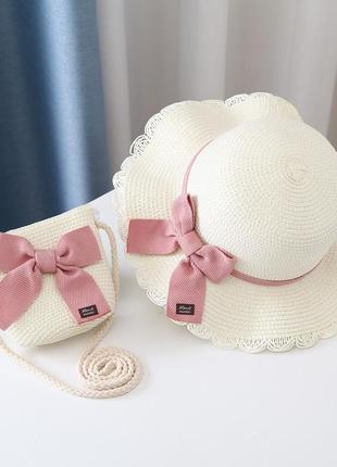 Комплект детская солнцезащитная соломенная шляпа канотье и соломенная сумочка цвет белый декор розовый бант1 фото