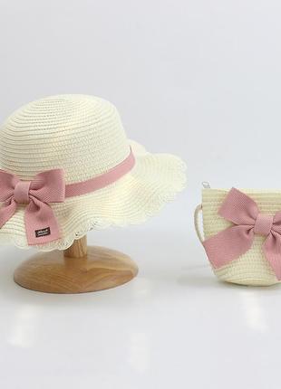 Комплект детская солнцезащитная соломенная шляпа канотье и соломенная сумочка цвет белый декор розовый бант2 фото