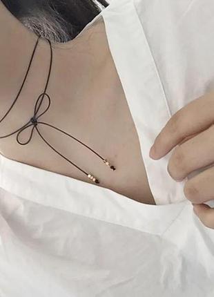 Модний шкіряний чокер на ключиці з кысточками у вигляді банта у стилі харадзюку