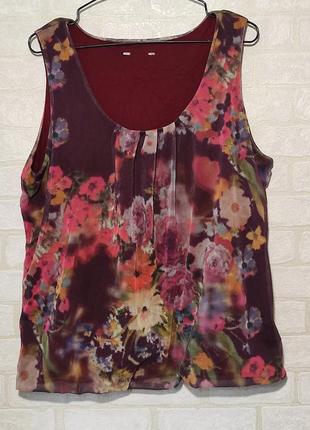 Цветная блуза с цветочным принтом.1 фото