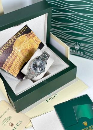 Часы наручные женские серебряные черный циферблат с камнями стразами брендовые ролекс rolex1 фото