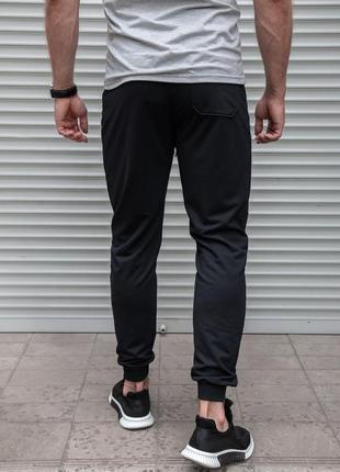 Чорні спортивні штани на манжетах3 фото