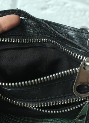 Компактна і стильна сумочка з натуральної шкіри.3 фото