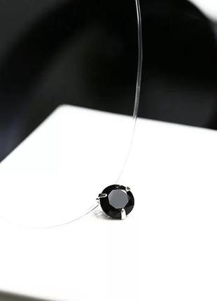 Прикраса чорний камінець на прозорому шнурку1 фото