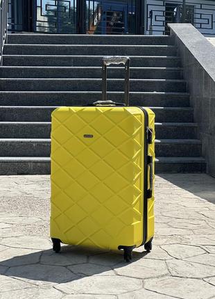 Качественный чемодан,польнее,противоударный пластик,ухие размеры,кодовый замок,wings6 фото