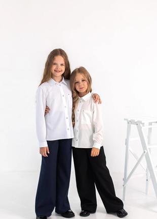 Шкільні блузки і брюки для дівчаток