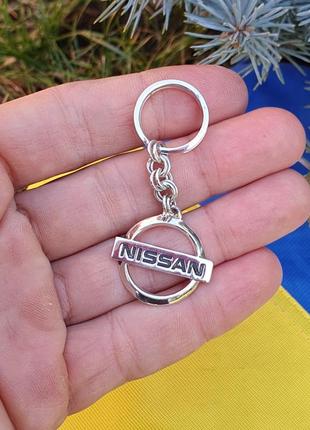 Брелок nissan из серебра2 фото