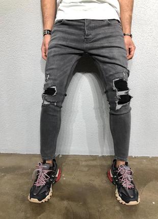 Мужские рваные джинсы серого цвета1 фото