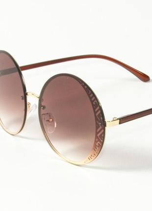 Женские солнцезащитные круглые очки 80-664/3 коричневые3 фото