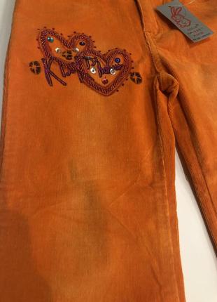 Вельветовые оранжевые брюки для девочки5 фото