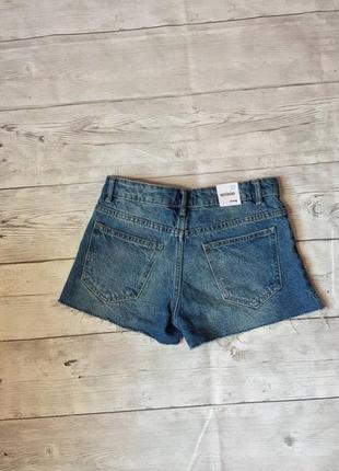Джинсовые рваные шорты средняя посадка с потертостями необработанный низ3 фото