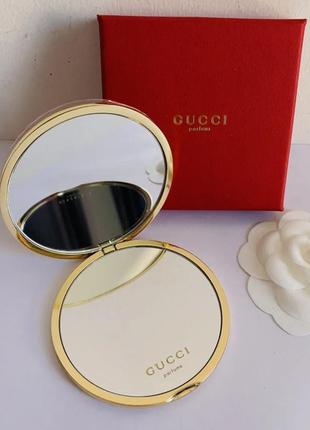Зеркало гуччи gucci parfums оригинал из сша косметическое карманное золотое зеркальце двухстороннее компактное с логотипами брендовое тиснение3 фото