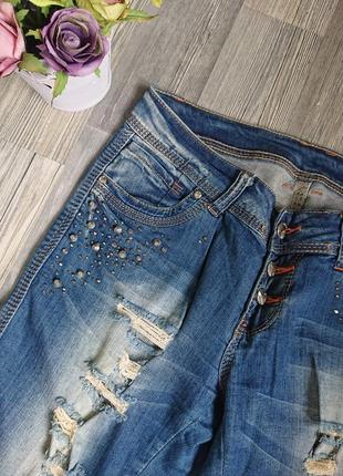 Женские джинсовые шорты с разрезами р.42/445 фото
