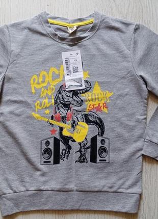 Новый реглан de facto на 7-9 лет.