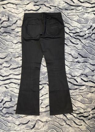 Женские джинсы клеш от колена prada2 фото