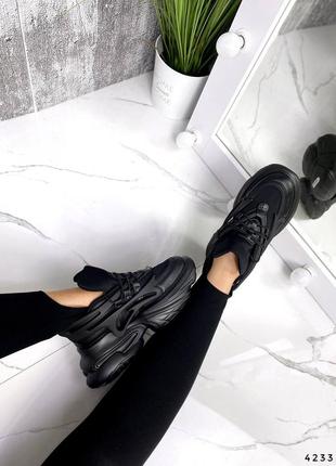 Тренд сезона черные кроссовки на массивной подошве3 фото