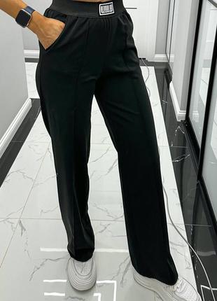 Стильні жіночі штани кльош з високою посадкою, чорні штани з кишенями та стрілками3 фото