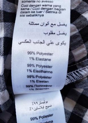 Блуза чорно-біла клітка  на одне плече з воланом 12 р-ру.10 фото