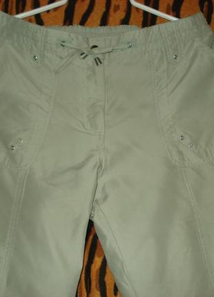 Штани спортивні блідо-салатового кольору"petites"р. 14,індонезія,поліестер.1 фото