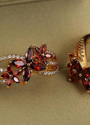 Кольцо xuping jewelry цветущий сад с красными камнями р 18  золотистое