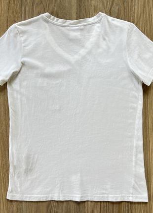 Жіноча біла бавовняна футболка з принтом champion2 фото