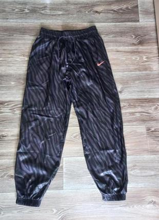 Жіночі спортивні брюки nike icon woven pant