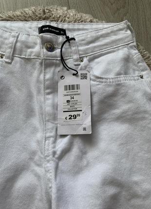 Белые джинсы с разрезами3 фото