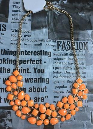 Ожерельяное колье, цепочка золотистая с оранжевыми камнями1 фото
