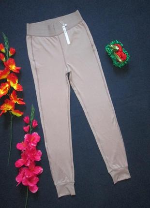 Шикарні спортивні жіночі брюки з манжетами кольору курній троянди asos 4505