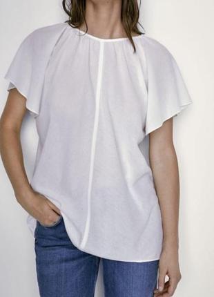 Біла блузка с розклешонними рукавами з нової колекції massimo dutti