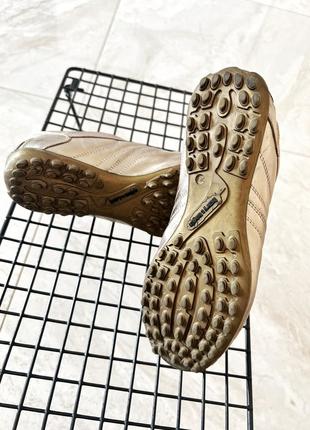 Золотые фирменные кроссовки с шипами настоящая кожа2 фото