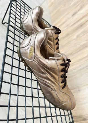 Золотые фирменные кроссовки с шипами настоящая кожа4 фото