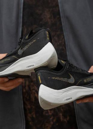 nike zoom x black gold 2300