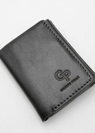 Стильний невеликий гаманець однотонний, чорне портмоне зі шкіри, портмоне з натуральної шкіри унісекс1 фото